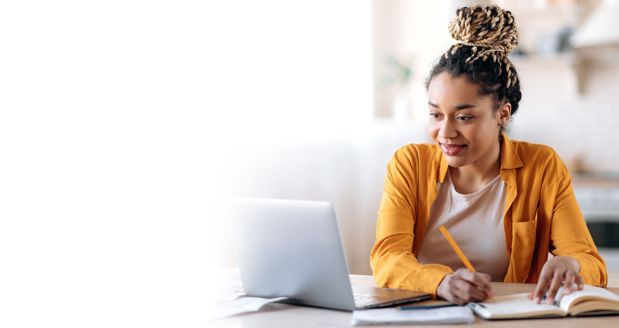 A student studying at her laptop